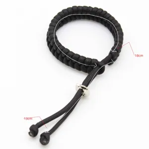 Black handmade paracord adjustable bracelet detail close-up showing size measurements.