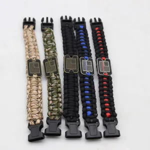 Handmade 7-strand paracord survival bracelet with metal flag tag and plastic buckle.