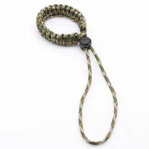 Paracord camera wrist strap detail view, durable braided nylon lanyard for outdoor sports.