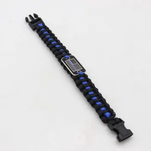 Handmade paracord bracelet with metal buckle and blue line flag emblem for outdoor sports.