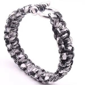 Bracelet de survie en paracorde noir et blanc avec manille en metal, bracelet de sport.