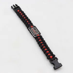Handcrafted black red paracord survival bracelet with metal tactical flag tag for outdoor sports.