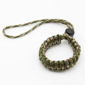 Camouflage green paracord camera wrist strap, durable survival braided lanyard for secure grip.