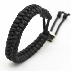 Handmade black paracord bracelet with adjustable metal slider for men and women daily wear.