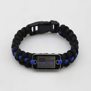 Black and blue paracord bracelet handmade outdoor survival gear with metal American flag tag style.