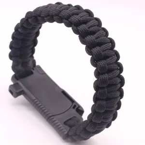 Black paracord survival bracelet with tactical plastic buckle for outdoor camping and hiking.