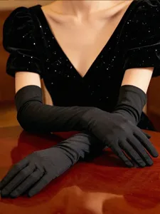 Detailed view of extra long 53cm black spandex gloves, perfect for evening retro dresses.