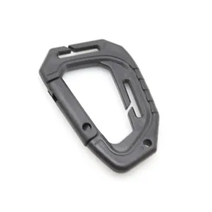 Detail view of durable black plastic tactical D-ring carabiner for backpack gear.