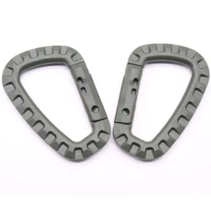 Tactical plastic D-ring carabiner detail showing textured grip and hinge construction.