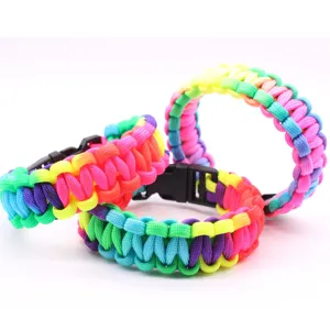 Colorful handmade paracord survival bracelet with durable plastic buckle for outdoor adventures.