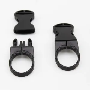 Detailed view of black plastic quick-release buckle and strap mount, showing sturdy structure.