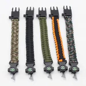 Multi-functional survival paracord bracelet with compass and rescue blade for outdoor camping.