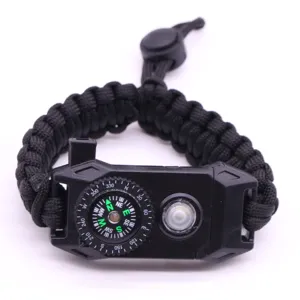 Outdoor survival paracord bracelet with integrated compass and LED emergency light for camping.