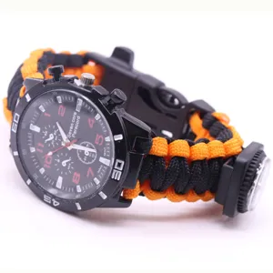 Detailed view of outdoor survival black and orange paracord watch with compass dial.