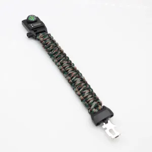 Detail view of tactical survival paracord bracelet with built-in compass and digital watch.