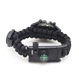 Black paracord survival watch detail view featuring a built-in compass and durable buckle.