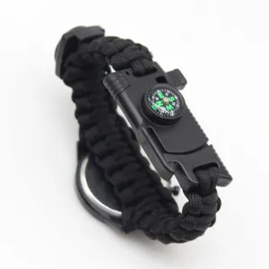 Detail view of black paracord survival watch strap with integrated compass and durable buckle.