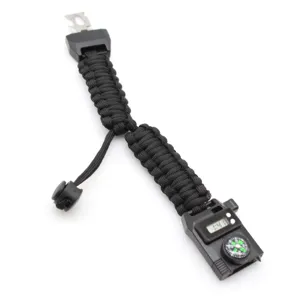 Outdoor tactical paracord survival bracelet with digital watch and compass for hiking.
