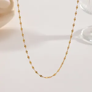 Detail shot of minimalist gold-plated stainless steel chain necklace, exquisite light luxury design.