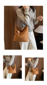 Stylish brown suede shoulder bag for women, large capacity commuter bucket bag with strap.