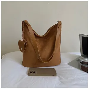 Brown suede shoulder bag for women, stylish large capacity commuter hobo bag with small pouch.