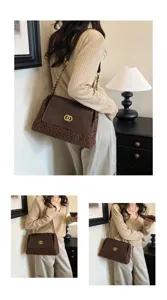 Detailed view of trendy chain shoulder bag with leopard print, stylish underarm fashion.