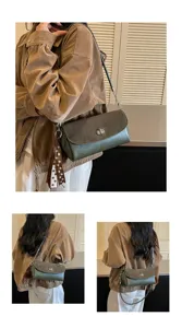 Trendy dark green shoulder bag with metal chain strap and cute polka dot ribbon charm.