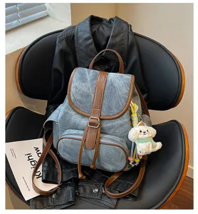 Casual denim backpack for women, stylish Korean style school bag with brown leather trim.