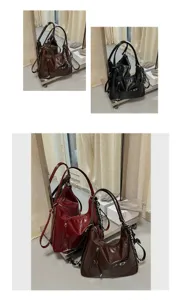 Detailed view of vintage slouchy hobo shoulder bag with soft leather texture and zipper pockets.