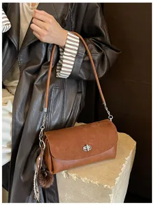 Stylish brown shoulder bag for women, chic suede leather underarm bag with turn lock.