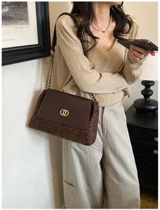 Detailed view of the stylish brown leopard print shoulder bag with chain and metal lock clasp.