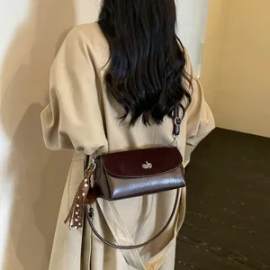 Classic retro women shoulder crossbody bag with metallic twist lock and chic ribbon charm.