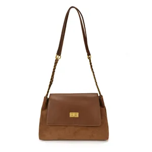 Brown suede leather shoulder bag with chic chain strap and metal turn lock for women style.