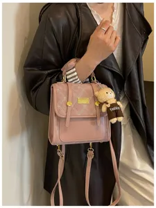 Chic pink quilted mini backpack for women, stylish daily casual faux leather school book bag.