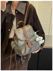 Distressed retro backpack detail, casual minimalist canvas and leather women daypack.