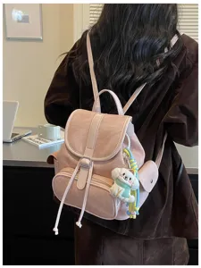 Chic pink casual backpack for women, lightweight daily commuter bag with cute dog pendant.