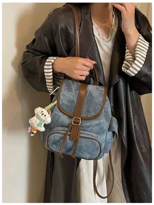 Casual denim backpack with brown leather trim, stylish daily school bag for women