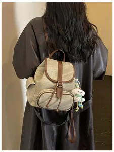 Casual minimalist canvas backpack with leather trim, stylish Korean design for daily commute.