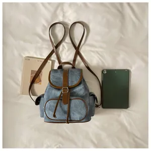 Minimalist casual canvas backpack for women, stylish daily commute travel daypack with brown trim.