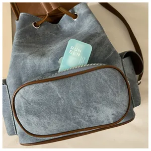 Denim bucket backpack for women casual daily commute vintage style stylish blue bookbag detail