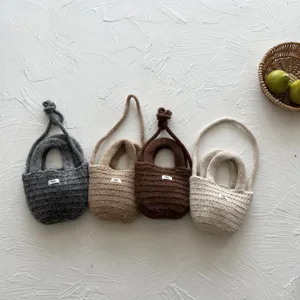 Handcrafted knit mini crossbody bag set featuring cute textured design and lovely colors.