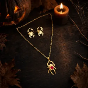 Halloween spider necklace and earrings set featuring gothic gold tone design with red crystal detail for festive styling.