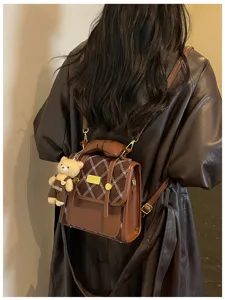 Stylish brown quilted women's backpack with cute bear pendant, retro commuter bag