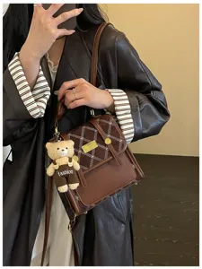 Women stylish brown retro shoulder backpack with cute bear pendant for autumn commute