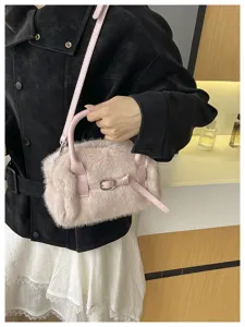 Chic fluffy pink plush handbag for women, trendy faux fur crossbody pillow bag for winter.