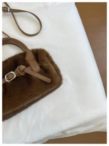Chic brown plush crossbody bag for women, cozy winter fluffy shoulder handbag stylish.
