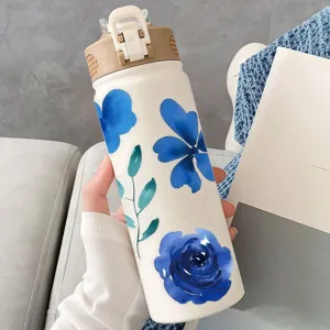 Blue watercolor flower sticker detail showing aesthetic floral design on water bottle surface