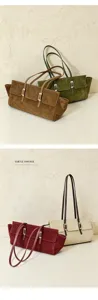 Detailed view of vintage suede underarm shoulder bags featuring sleek metal buckles and twin straps.