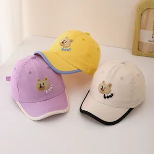 Cute baby baseball cap with adorable bear embroidery for infants and toddlers in spring.