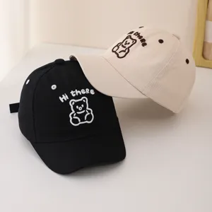 Close-up detail of cute embroidered bear baseball cap, soft cotton fabric, adjustable strap.